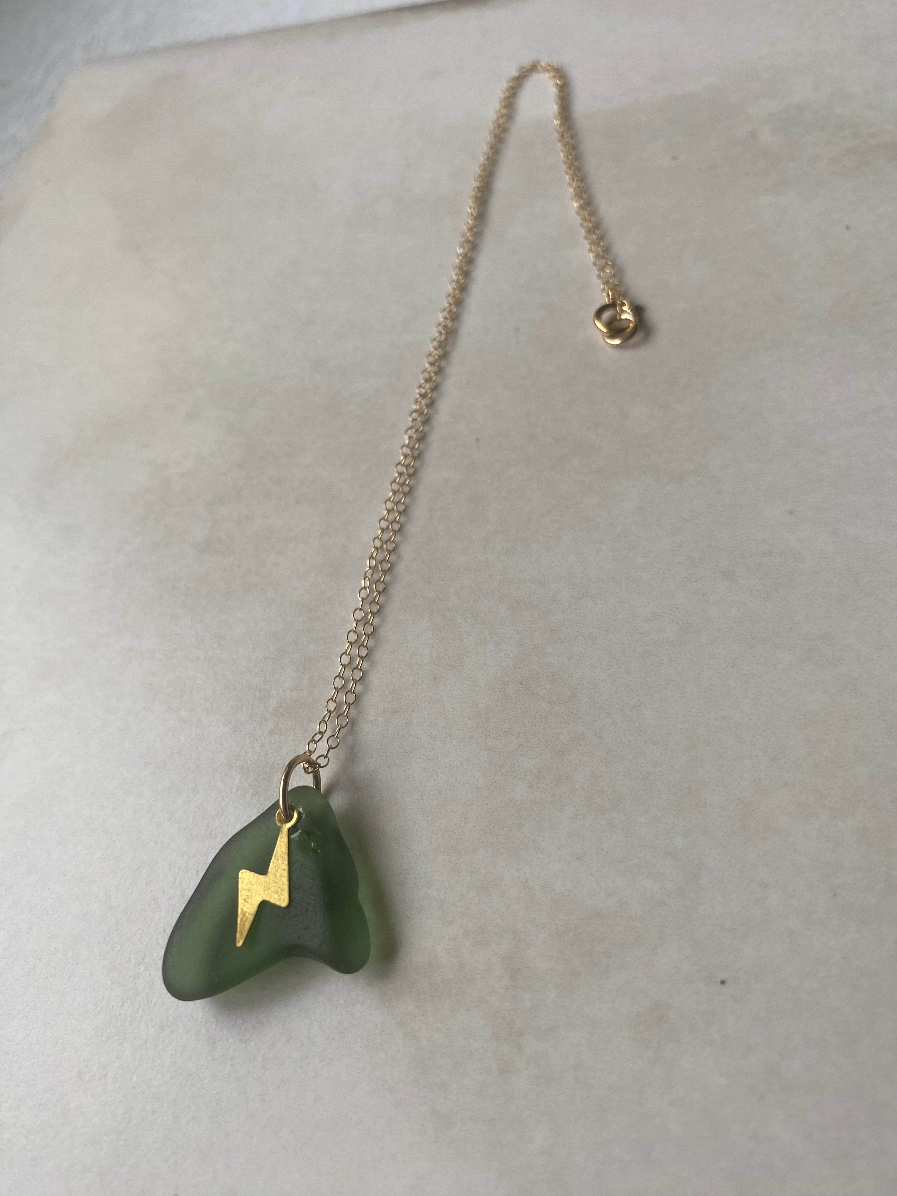 Joy sea glass necklace: Brass lightening bolt (green)