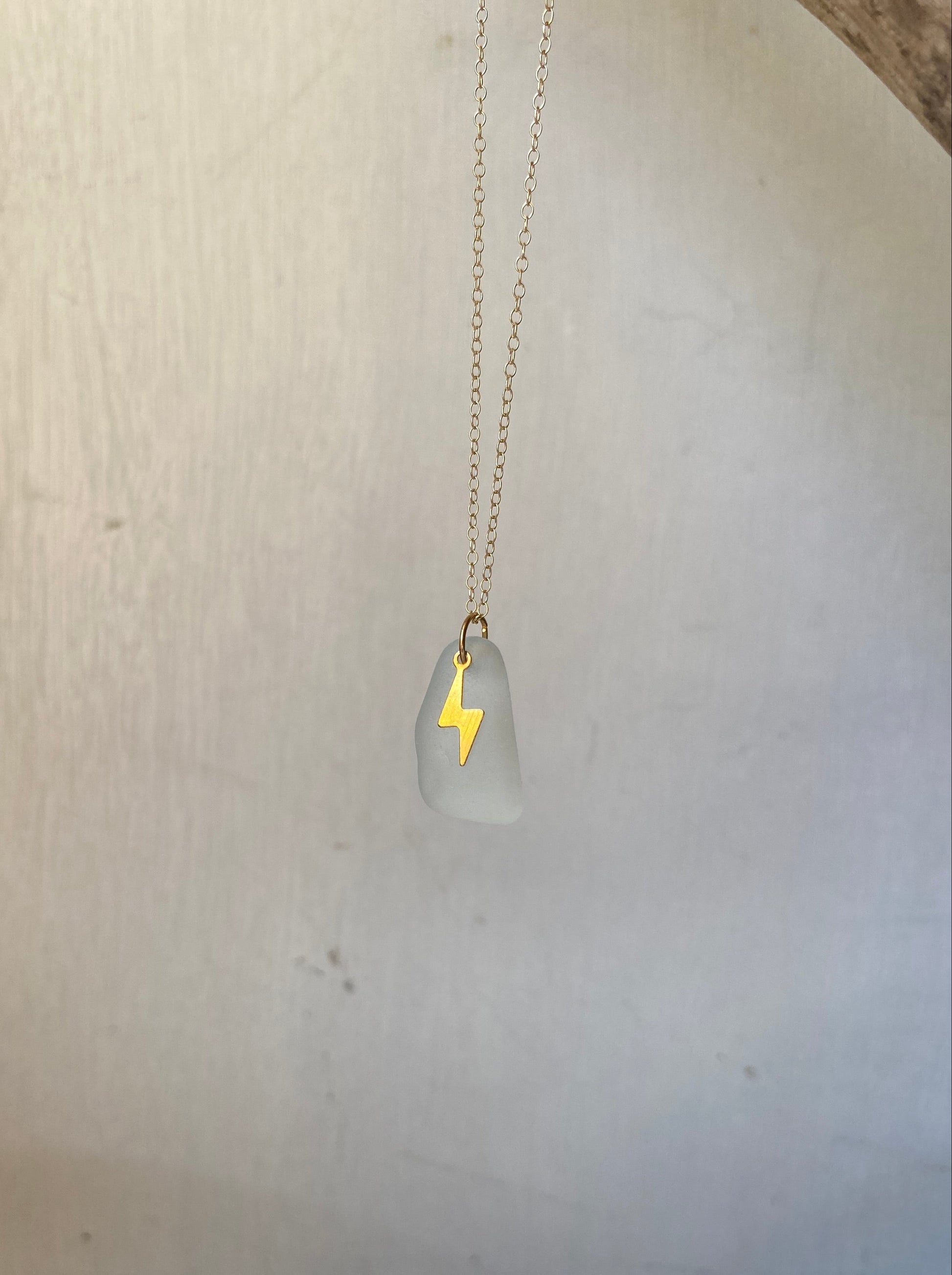 Joy sea glass necklace: Brass lightening bolt (white)